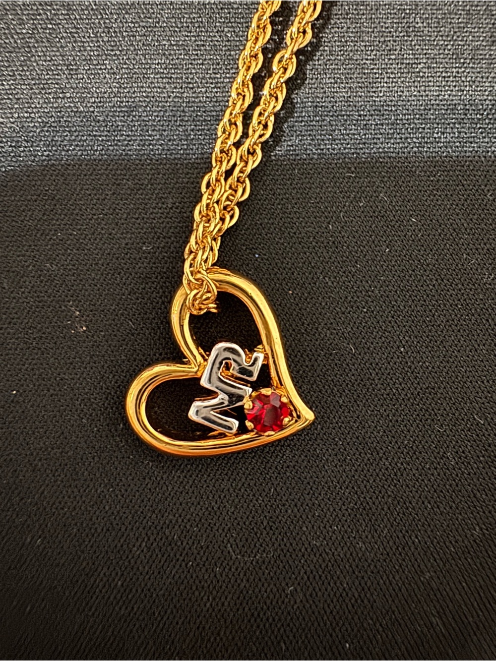 Nina Ricci Gold-Tone Heart Necklace with Red Gem and Silver 'N' Accent